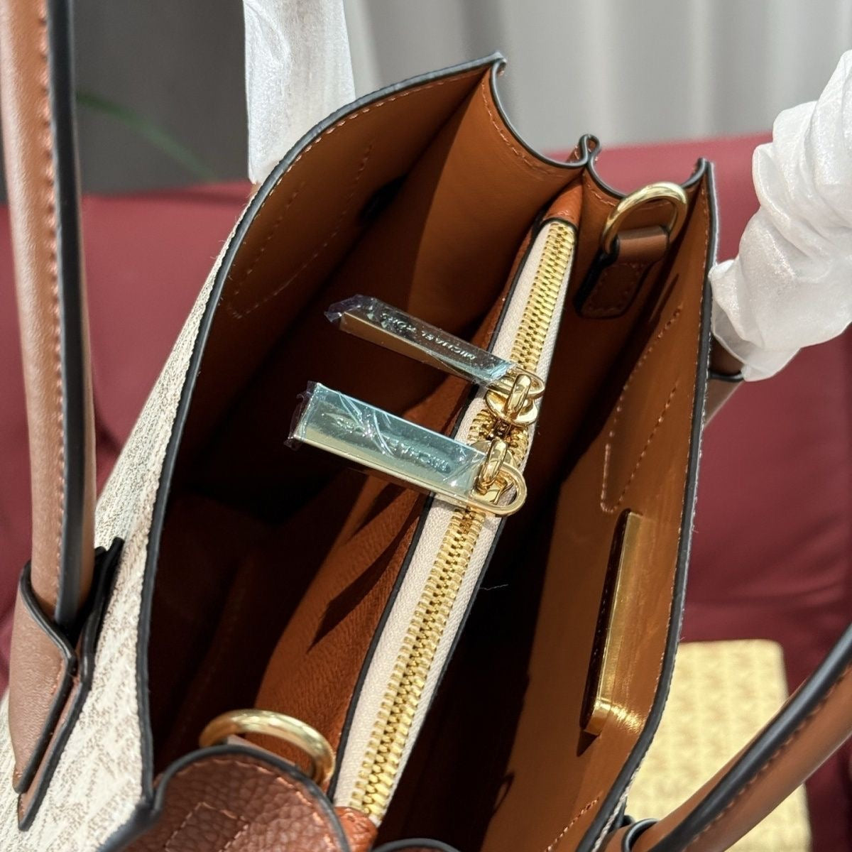 Michael Kors Cream and Brown
Satchel with Crossbody Strap