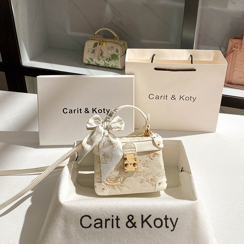 Carit & Koty Cream Embroidery Bag with Gold Lock
